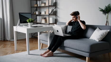 young person working from home on laptop