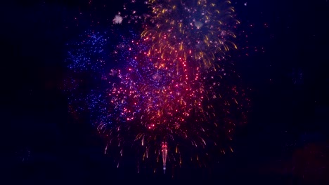 spectacular fireworks from a professional large fireworks event display seamless loop background for birthday, anniversary, celebration, holiday, new year, party, event celebrations, invitation