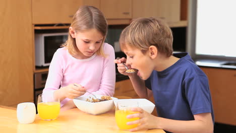 happy children eating their breakfast