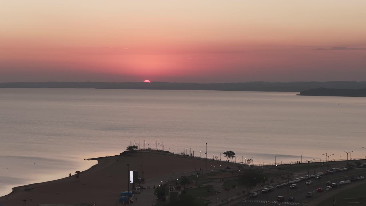 Aerial view of sunset over the horizon in Encarnación, Paraguay