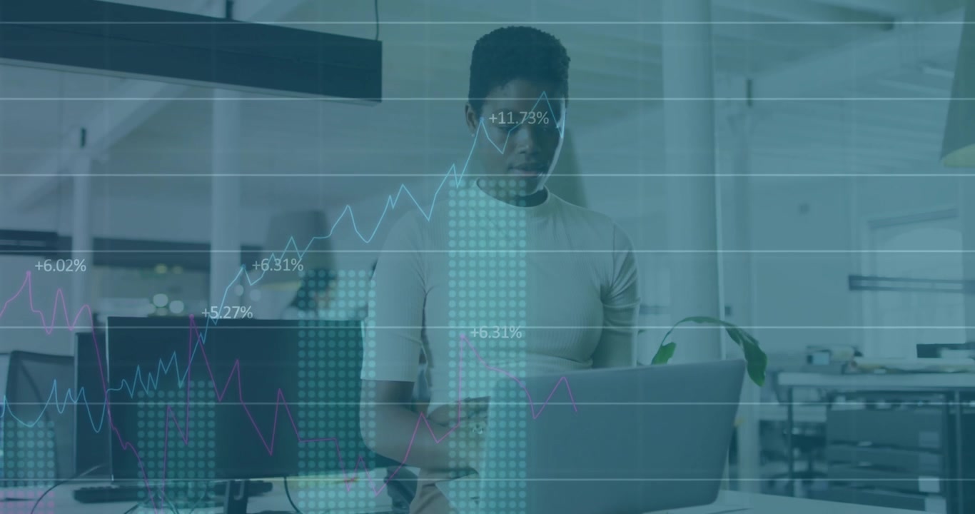 Coworker crossing shifting focus to analyst typing causing financial charts animating receding