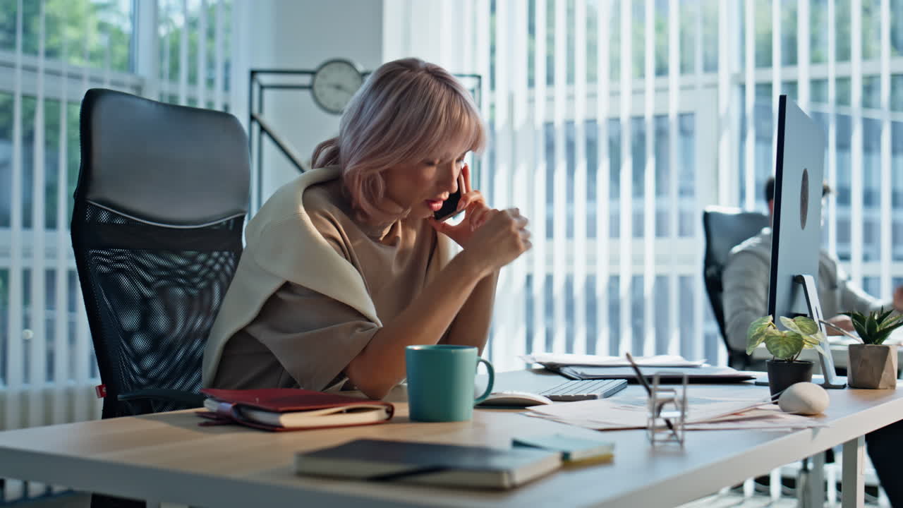 Focused manager negotiating mobile phone office closeup. Businesswoman talking