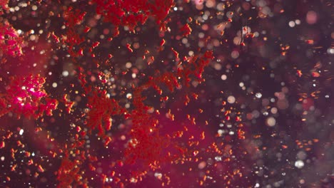 bright blood red particles forming abstract liquid texture background