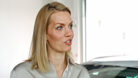 woman in conversation at a car dealership