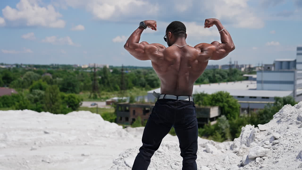 Young shirtless strong man. Handsome young sportive athletic man with naked torso