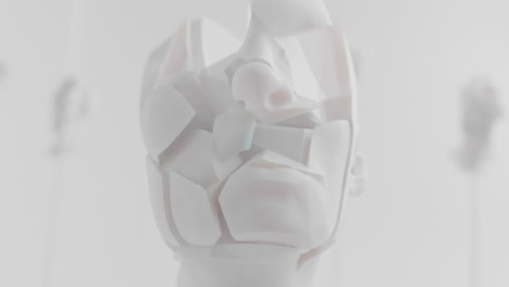 destroyed android head on spike in white space