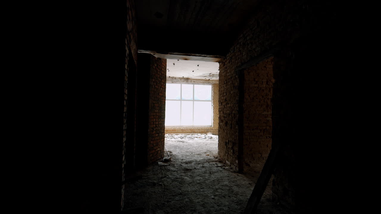 Newly constructed brick building tour. Walking by the premise with dirty floors and dark empty halls.