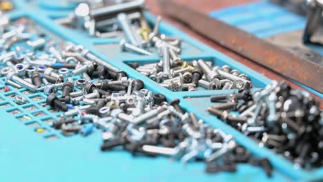 the building blocks of modern drone warfare: a detailed shot of components in a ukrainian lab, highlighting the scale of production for low-cost, expendable military assets