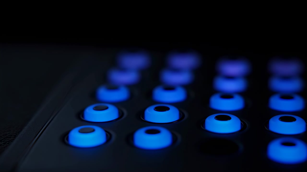 Progressive close-up sequence showing illuminated circular rubber buttons on dark electronic control panel located center-right of frame