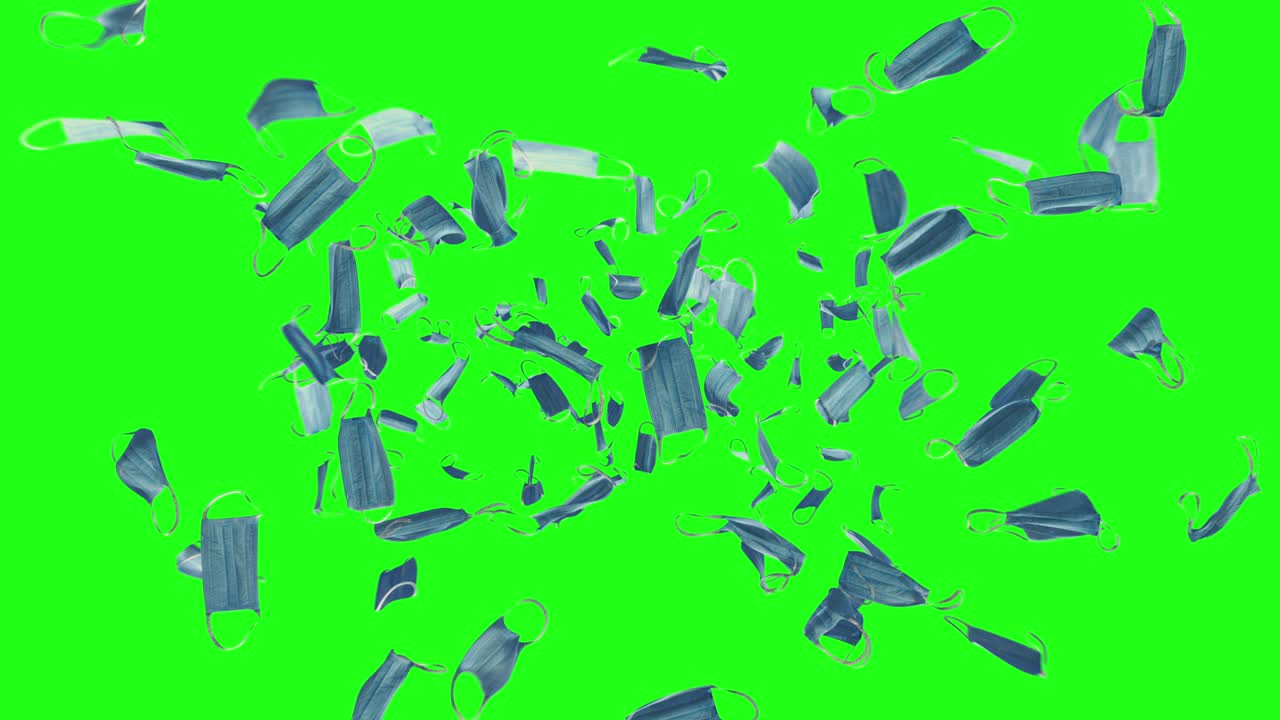 Hundreds of medical face masks falling down on green screen. 3D animation
