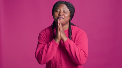 female begging with her hands together