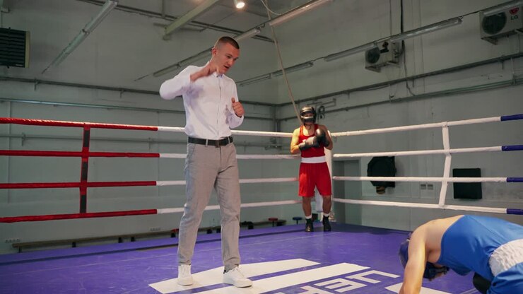 Boxing match in a ring with referee