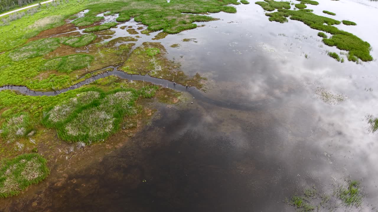 Aerial drone shot of wetlands and reflective water surfaces near the Les Cheneaux Islands in Michigan’s Upper Peninsula
