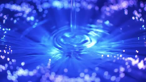 clear water creates beautiful ripples as it flows, surrounded by shimmering blue light. the tranquil atmosphere invites calmness and relaxation.