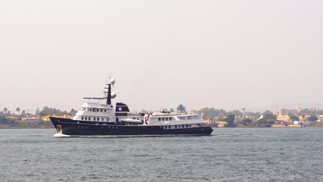 passenger ship passing through the san diego bay harbor on the pacific ocean coast