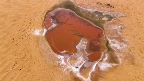 aerial shot of the heart-shaped wulan lake in tengger desert in china