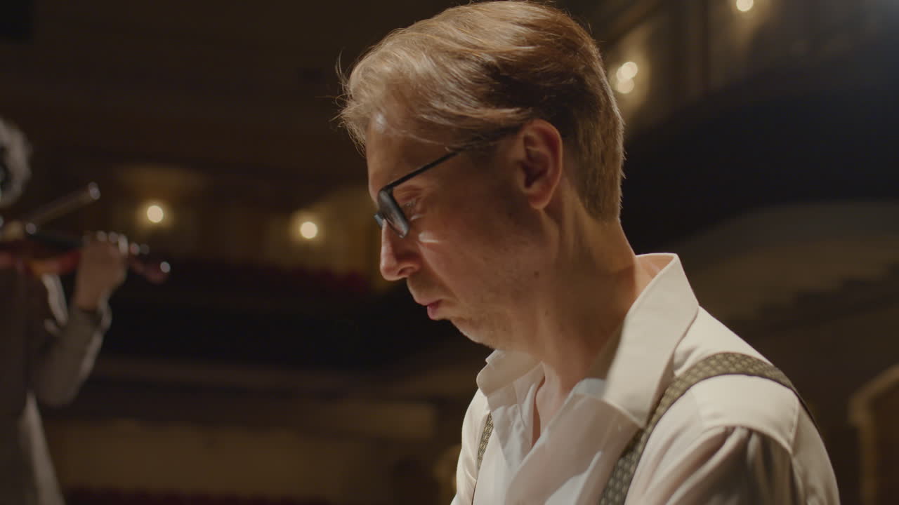 Man Playing Piano with Violin Accompaniment