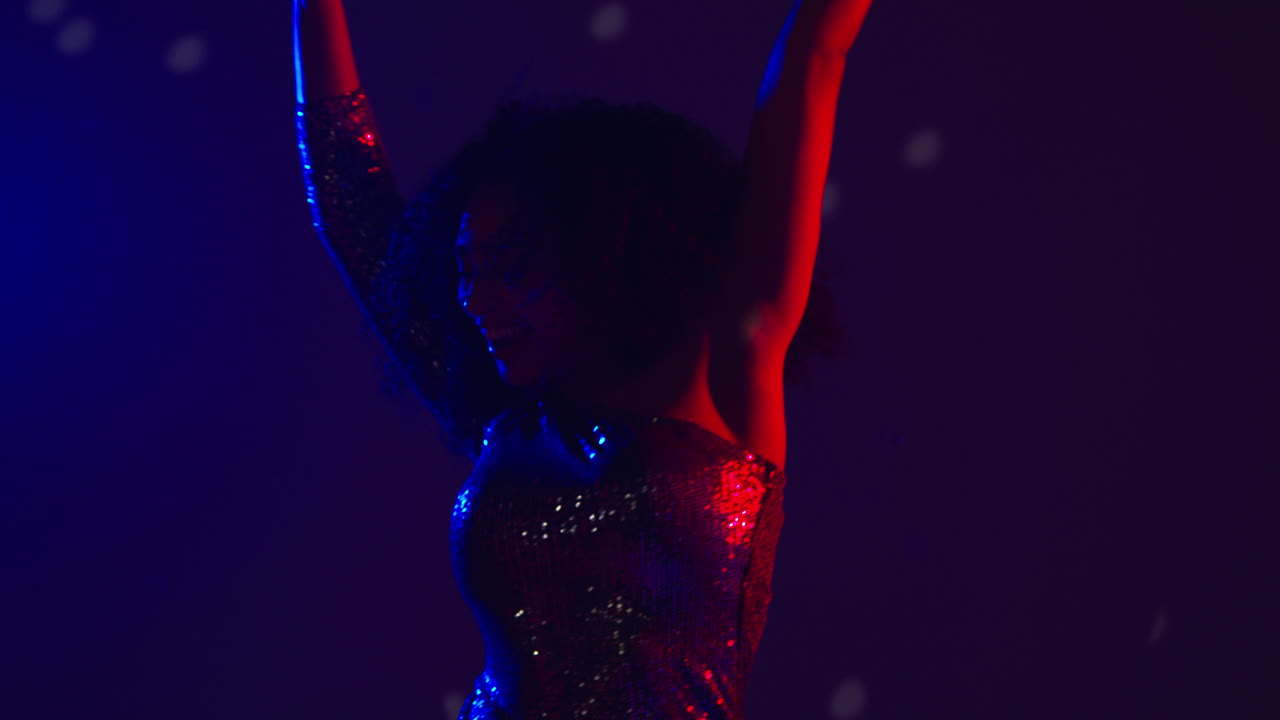 Close Up Of Woman In Nightclub Bar Or Disco Dancing And Having Fun