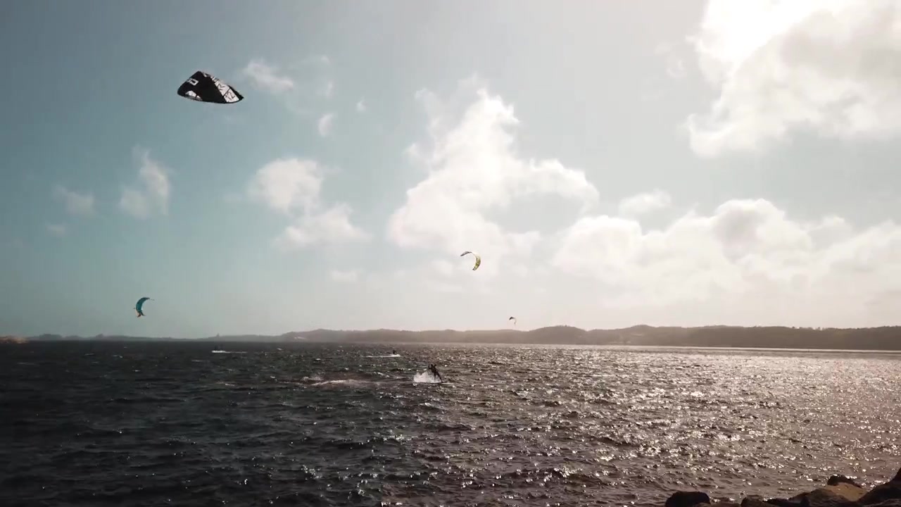 Kitesurfer jumps then falls into the ocean