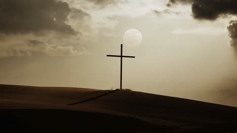 cross on a hill at dusk