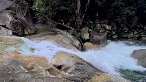 Water-Cascading-Down-And-Over-Rocks-At-Josephine-Falls,-Cairns,-Australia