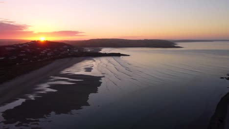 aerial-view-of-an-orange-sunrise-behind-the