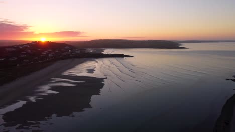 aerial view of an orange sunrise behind the