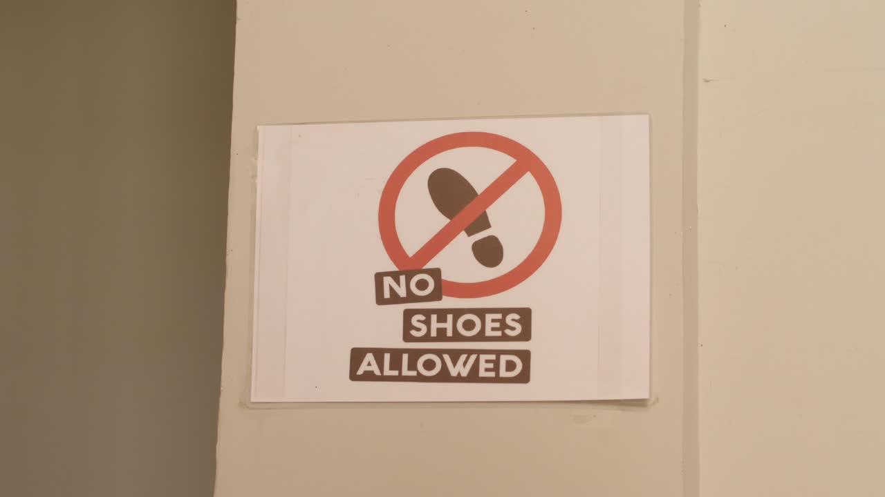 no shoes allow sign in the entrance of a coffee packaging facility.