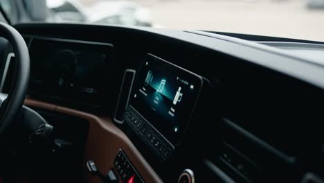 truck driver browsing on a screen dasboard inside of a freightliner cascadia volvo 2023 truck