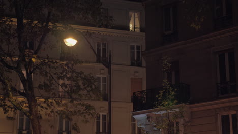 drizzling outside view to the houses and lantern at autumn night