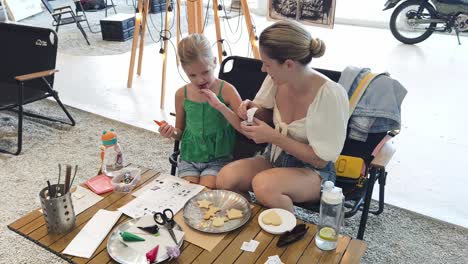 mother and daughter decorating cookies