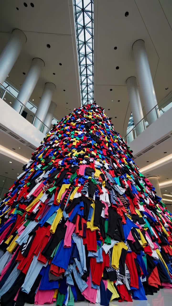 Colorful Clothes Pile Art Installation in Modern Shopping Mall