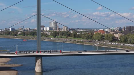 Train-is-going-on-Rheinkniebrucke-Bridge,-transportation-scene-from-Dusseldorf,-Germany