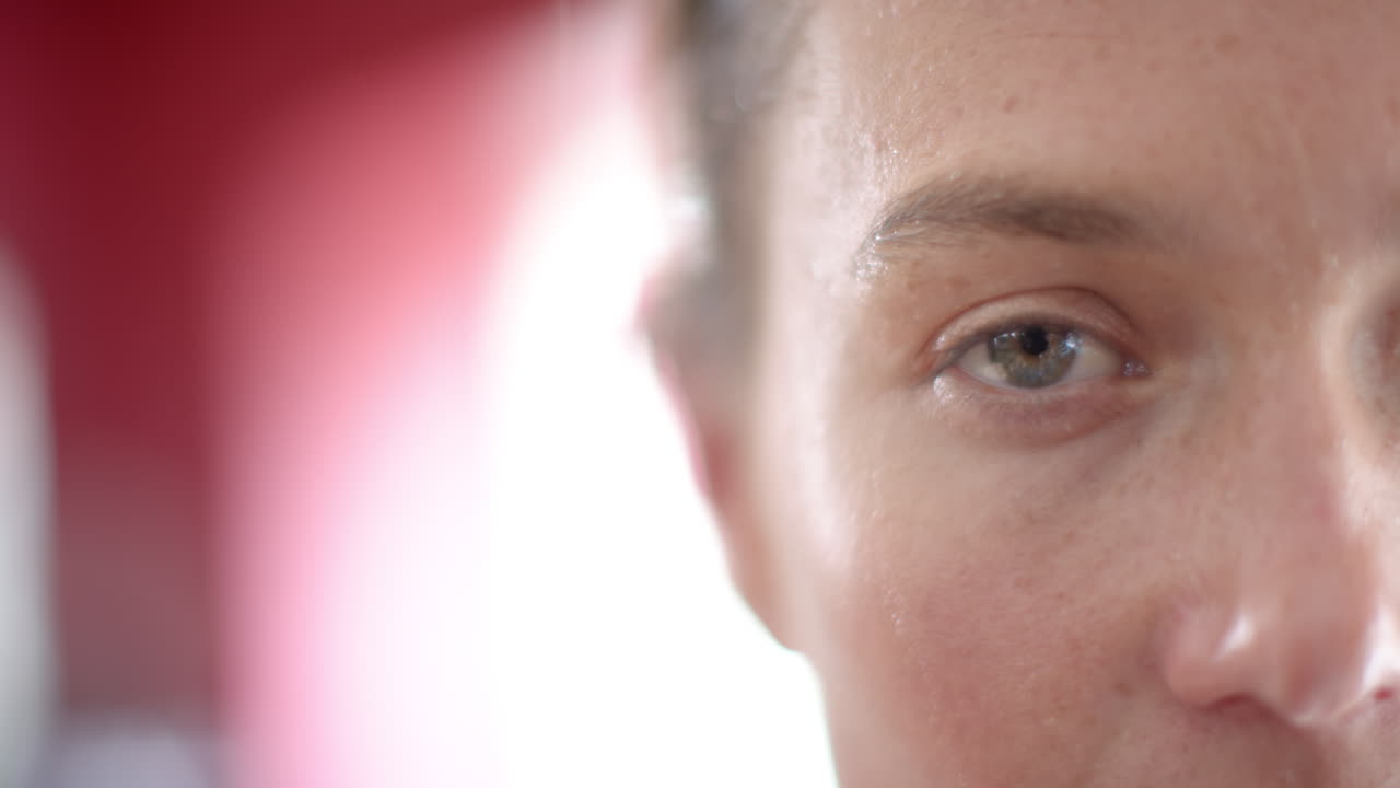 Close-up of a young Caucasian woman's face, with copy space