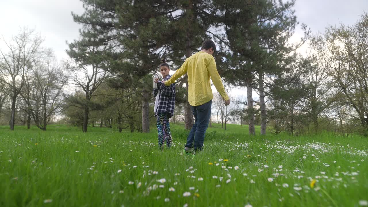 Woman in a park enjoying a drink