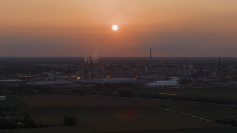 industrial and port area of ravenna ,chemical and petrochemical pole,thermoelectric,metallurgical plants and hydrocarbon refinery and liquefied natural gas tanks at sunset