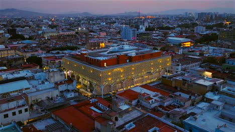 illuminated mercado corona in guadalajara city center, jalisco, mexico. aerial orbit