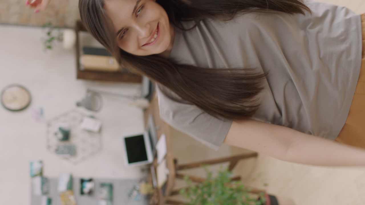 Vertical Portrait of Woman Dancing to Music