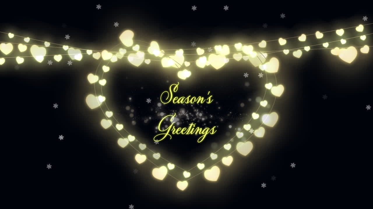 계절 인사 텍스트와 요정 빛은 검은 바탕에 심장 모양을 형성