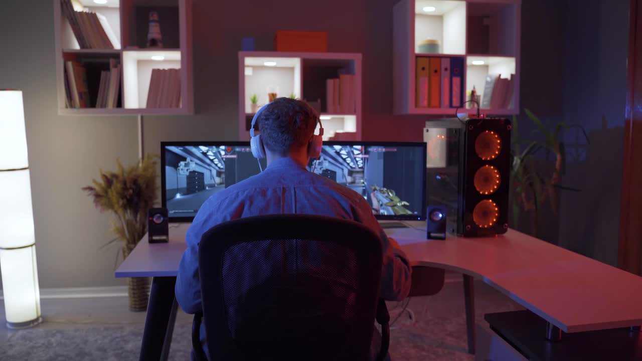 Professional eSports Player playing Video game on his Computer.