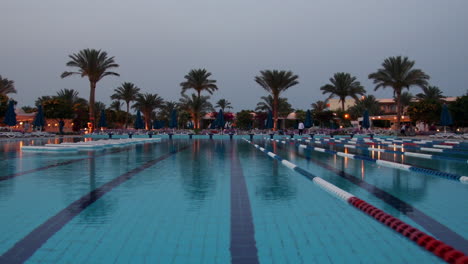 Sunset-swimming-pool-at-low-season-resort.-Beautiful-panorama-of-open-air-pool.