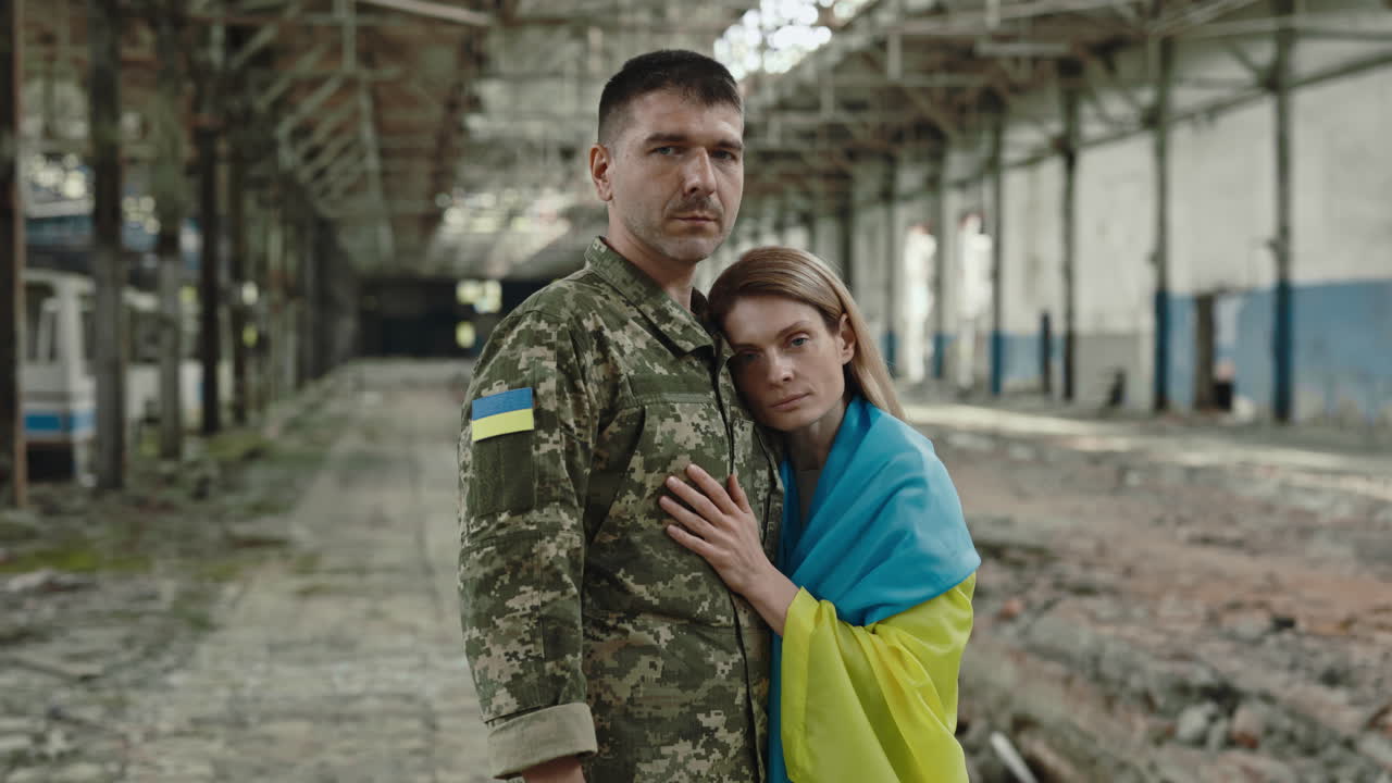 A Soldier and His Partner in a Desolate Factory