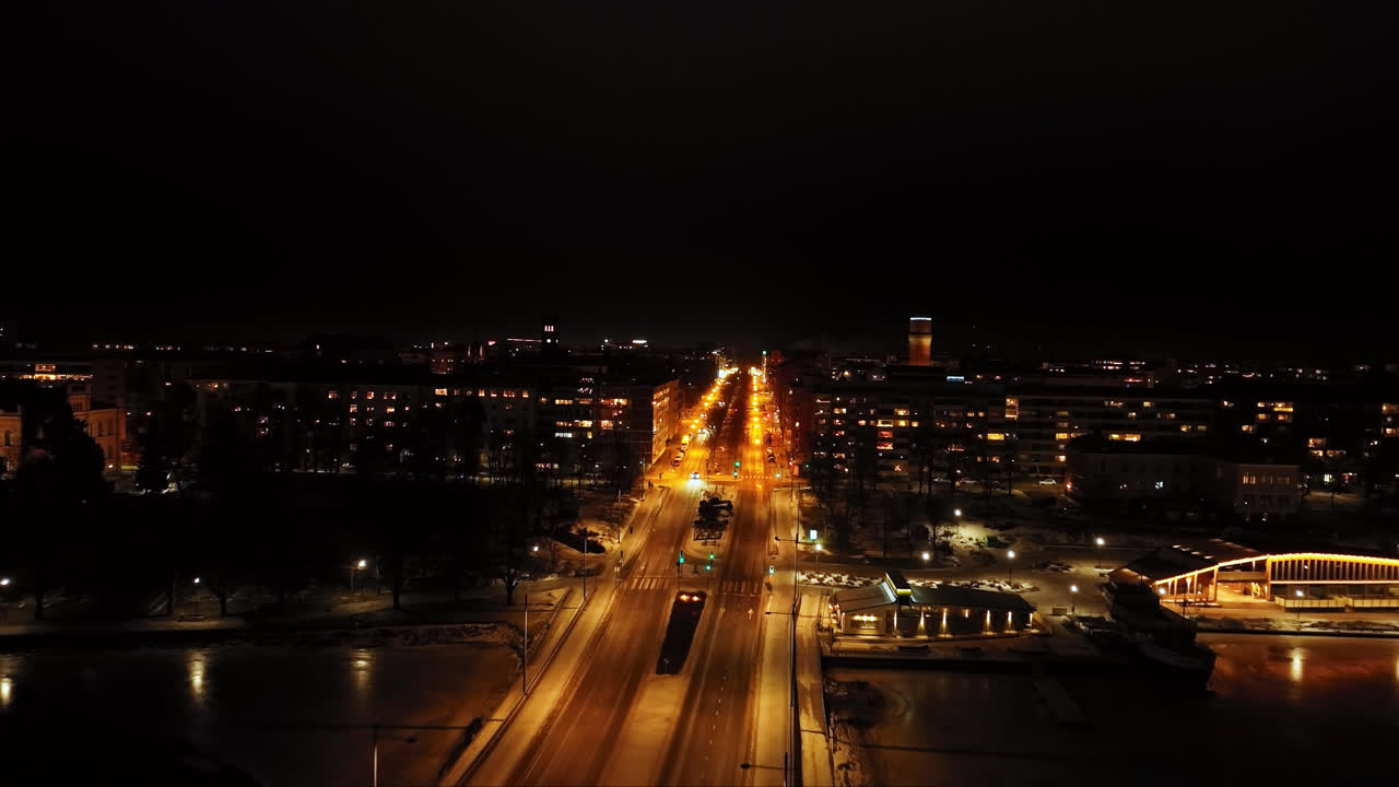 Aerial view fly&iacute;ng along the quiet E12 esplanade, night in Vaasa, Finland
