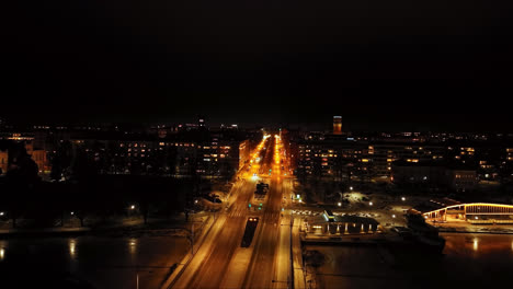 Aerial-view-flyíng-along-the-quiet-E12-esplanade,-night-in-Vaasa,-Finland