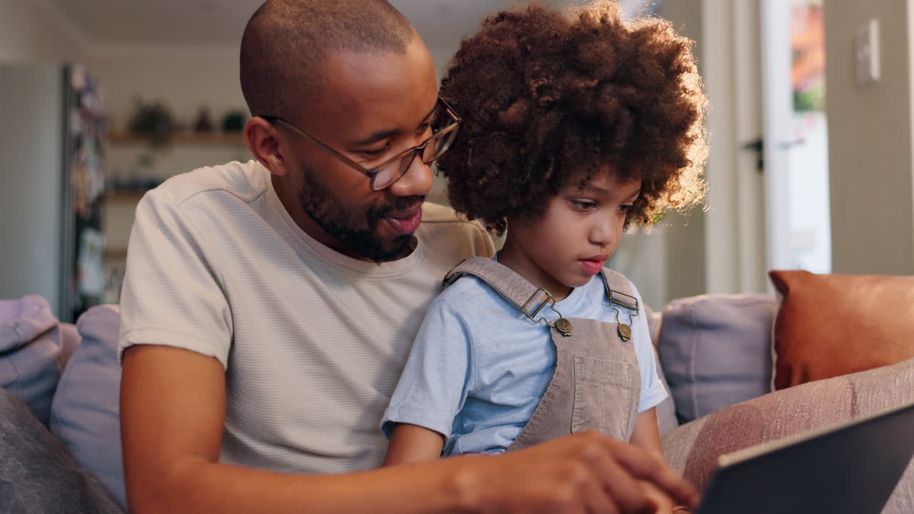 Father and Son Bonding with Tablet at Home