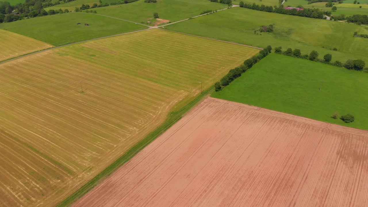 flying over colorful fields and roads