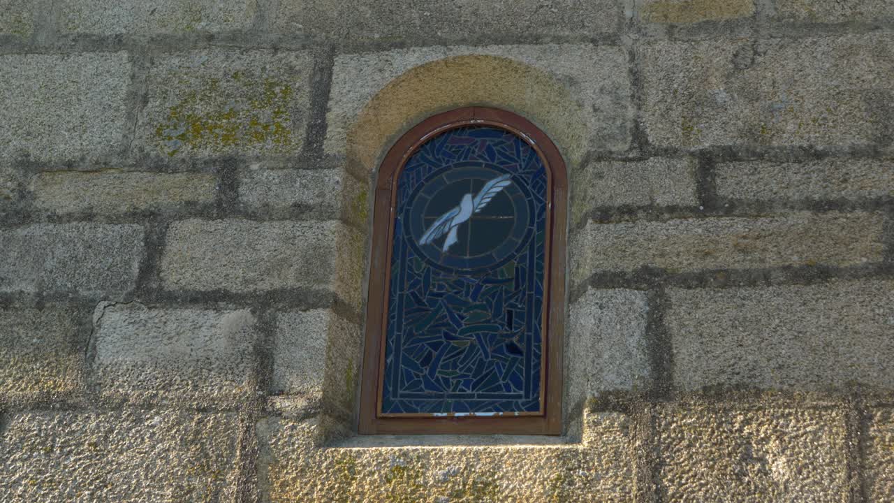 Medieval stone window of Santa María de Parada de Outeiro church in Vilar de Santos, Spain