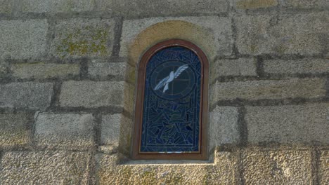 medieval stone window of santa maría de parada de outeiro church in vilar de santos, spain