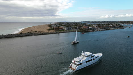 aerial view around a yacht and sailboat at the newport beach, in los angeles, usa