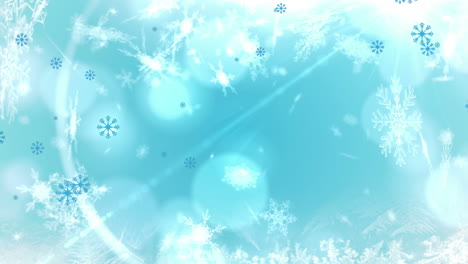 Animation-of-snowflakes-and-lens-flares-over-blue-background